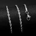 Gold Cuban Link Chain displayed on a black surface showcasing its fine craftsmanship and clasp detail.