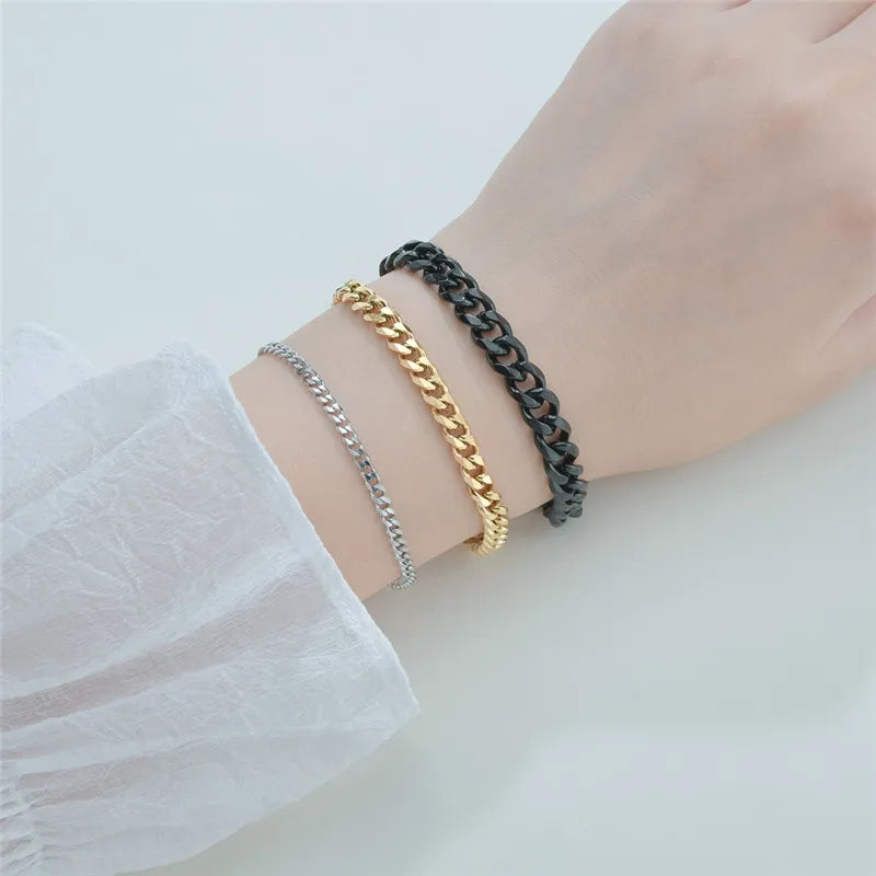 Luxury gold, silver, and black stainless steel curb Cuban chain bracelets layered for elegant, professional style. - LETAPI Fashion Stainless Steel Curb Cuban Chain Bracelet for Men Women Hip Hop Couple Unisex Wrist Hand Jewelry Gift Party - Black Color / 22cm / Width 7mm - from-ae-fiidom
