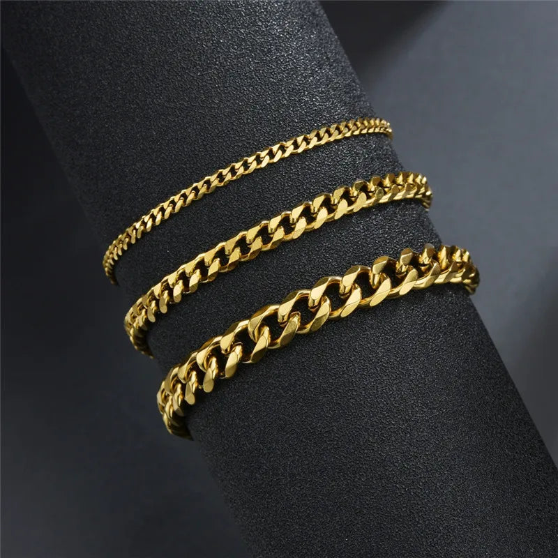 Three gold stainless steel curb Cuban chain bracelets in varying widths, exuding luxury and professional style. - LETAPI Fashion Stainless Steel Curb Cuban Chain Bracelet for Men Women Hip Hop Couple Unisex Wrist Hand Jewelry Gift Party - Black Color / 22cm / Width 7mm - from-ae-fiidom